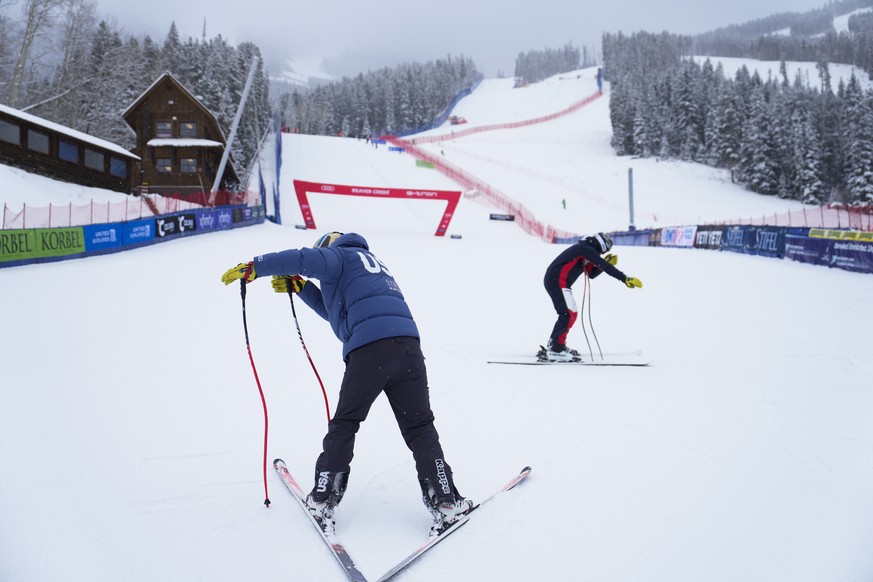 United States&#039; River Radamus, left, prepares to compete as crews inspect the course after competition was delayed during a men&#039;s World Cup downhill skiing race Friday, Dec. 1, 2023, in Beave ...