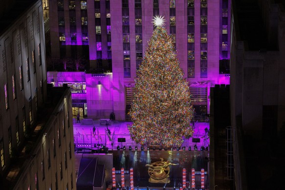 epa11002800 The Rockefeller Christmas Tree is lit for the first time this season during the 91st lighting ceremony in New York, New York, USA, 29 November 2023. The 80-foot Norwegian spruce has about  ...