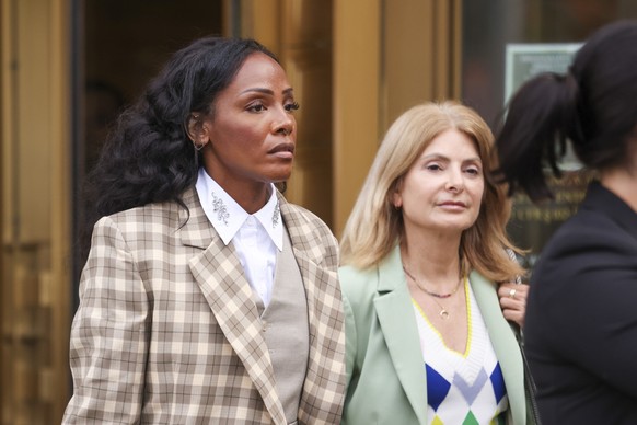 epa12107902 US singer Dawn Richard (L) and her lawyer Lisa Bloom (R) exit a federal courthouse after her first time taking the stand in the Sean &#039;Diddy&#039; Combs trial for sex trafficking, rack ...