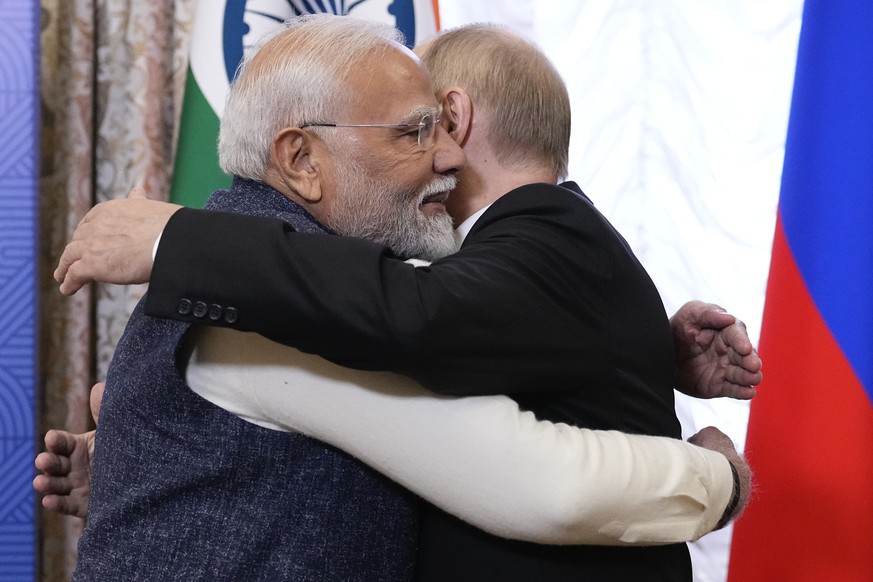 Russian President Vladimir Putin, right, embraces Indian Prime Minister Narendra Modi during their meeting on the sidelines of BRICS Summit at Kazan Kremlin in Kazan, Russia, Tuesday, Oct. 22, 2024. ( ...