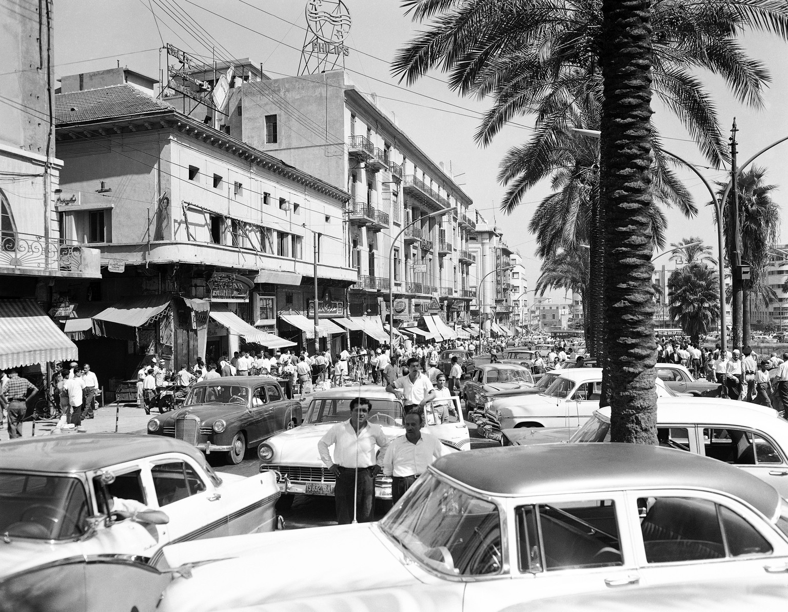 Policemen on motorcycles patrol a Beirut Street on May 19, 1958. Disorders and the imposed curfew keep people indoors. (AP Photo/Mario Torrisi)