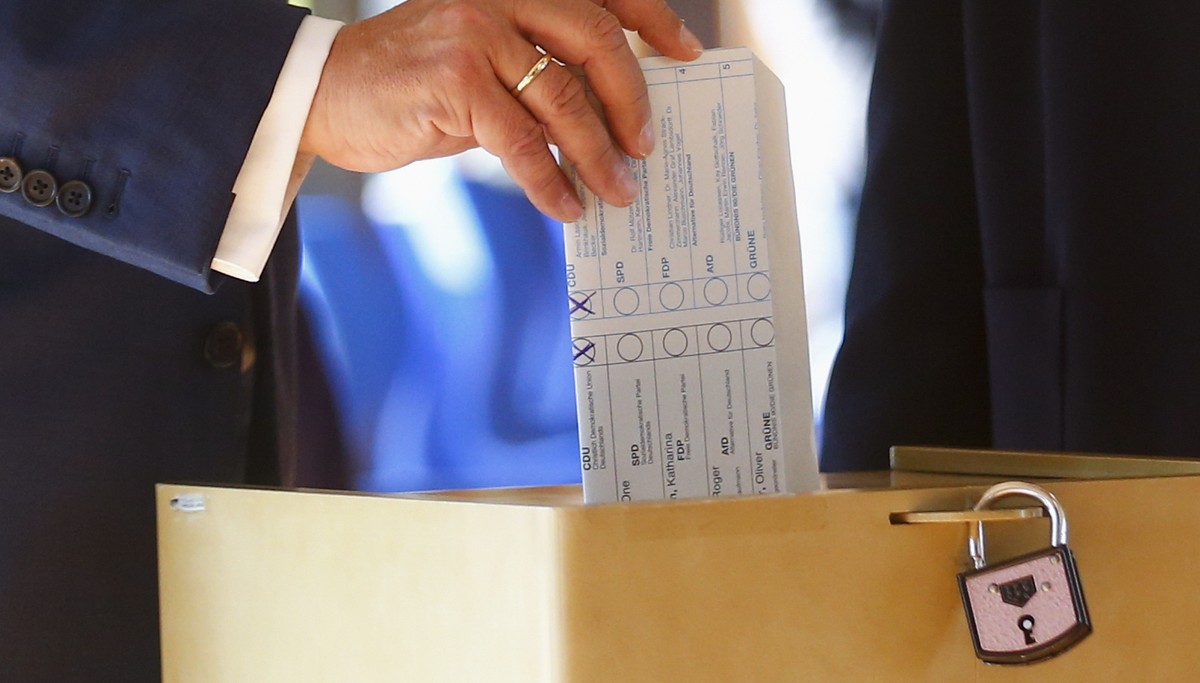 Armin Laschet, Christian Union parties candidate for Chancellery and Minister President of North Rhine-Westphalia, casts his ballot for the German parliament election in Aachen, Germany, Sunday, Sept. ...