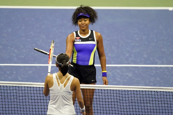 Naomi Osaka, of Japan, above, greets Misaki Doi, of Japan, at the net after defeating her during the first round of the US Open tennis championships, Monday, Aug. 31, 2020, in New York. (AP Photo/Fran ...