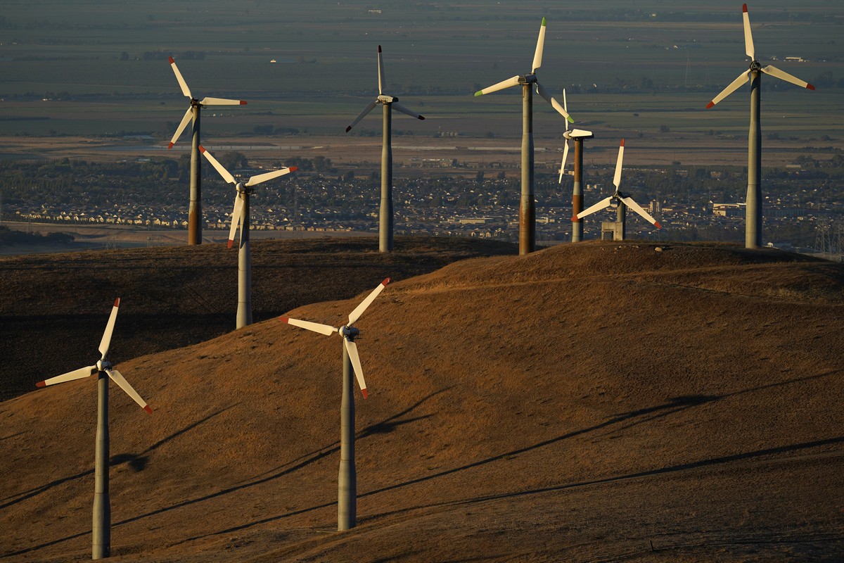 FILE - Wind turbines work in Livermore, Calif., Aug. 10, 2022. Federal energy regulators on Monday, May 13, 2024, approved a long-awaited rule to expand the amount of renewable energy such as wind and ...