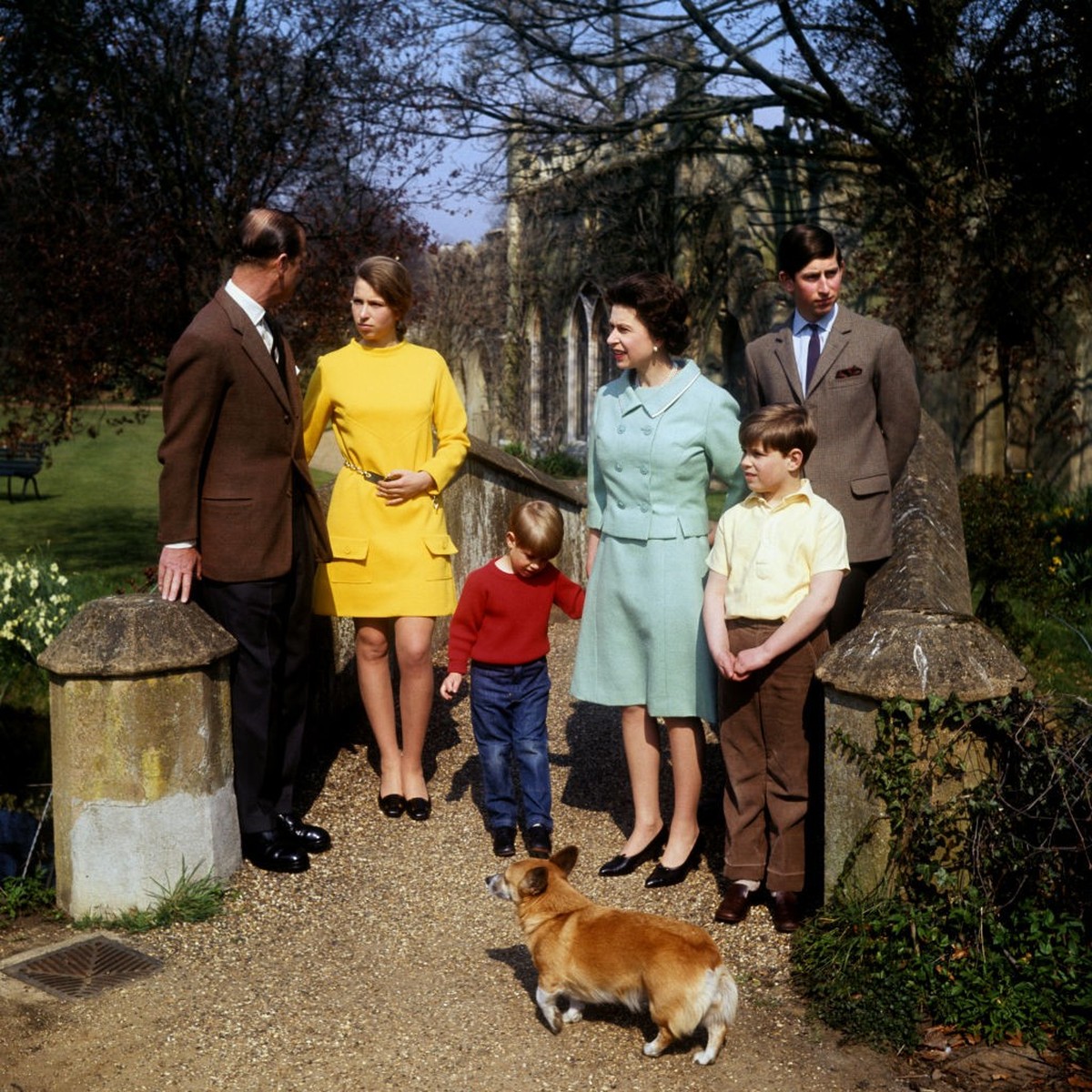 Queen Elizabeth II, Prince Charles, Prince Edward, Prince Andrew and Princess Anne listening to the Duke of Edinburgh on a bridge in the grounds of Frogmore, Windsor. (Photo by PA Images via Getty Ima ...