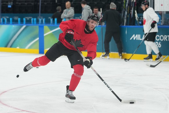 Canada's Connor McDavid takes a shot during men's ice hockey practice at the 2026 Winter Olympics, in Milan, Italy, Sunday, Feb. 8, 2026. (AP Photo/Carolyn Kaster)
Connor McDavid