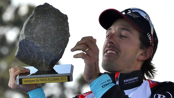 JAHRESRUECKBLICK 2013 - SPORT - Radioshack Leopard team rider Swiss Fabian Cancellara celebrates with the trophy on the podium after winning the 111th Paris Roubaix cycling race in Roubaix, France, 07 ...