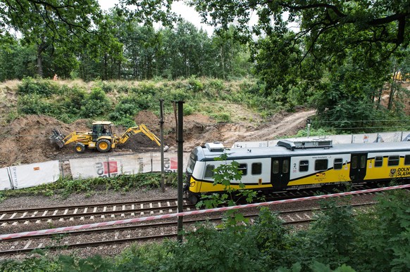 epa05489281 A digger works around the area on the 65th kilometer of the railway track Wroclaw-Walbrzych, during the attempt to explore the existence of the so-called &#039;Nazi Gold train&#039;, in Wa ...