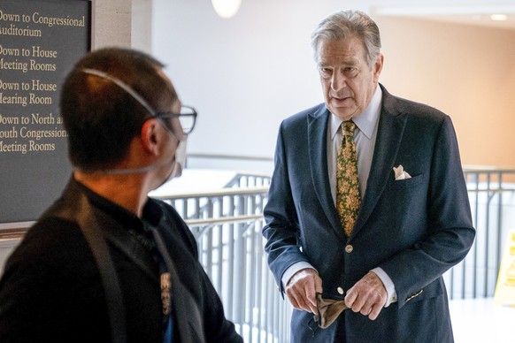 FILE - Paul Pelosi, right, the husband of House Speaker Nancy Pelosi, of California, follows his wife as she arrives for her weekly news conference on Capitol Hill in Washington on March 17, 2022. Hou ...