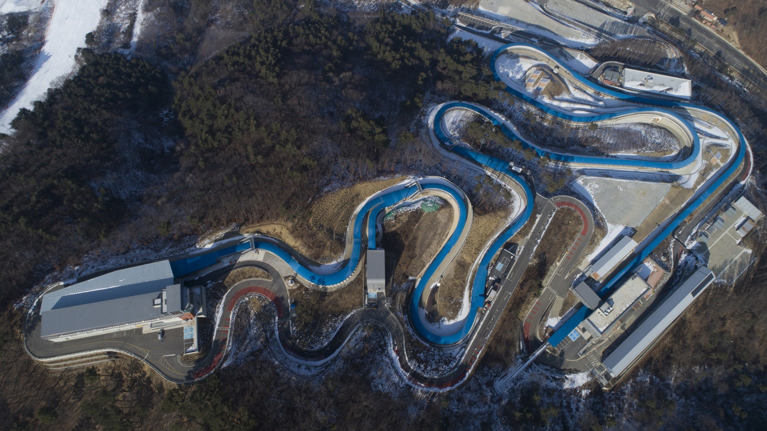 epa07315159 Picture taken with a drone shows the Olympic Sliding Center in the Alpensia ski resort which hosted events in Luge, Bobsleigh and Skeleton of the PyeongChang Winter Olympic Games 2018, Sou ...