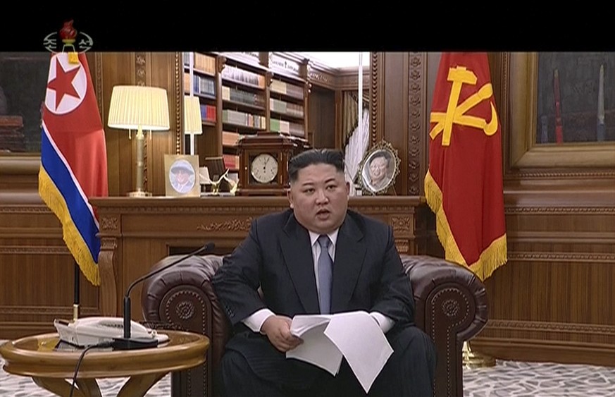 In this undated image from video distributed on Tuesday, Jan. 1, 2019, by North Korean broadcaster KRT, North Korean leader Kim Jong Un delivers a speech in North Korea. Kim says he hopes to extend hi ...