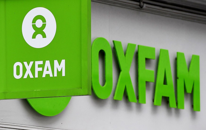 epa06525002 The Oxfam logo at a store in London, Britain, 14 February 2018. UK charity has admitted that several of their aid workers have been using sex workers while working in Haiti in 2011. EPA/AN ...