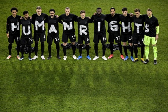 epa09097407 Germany?s starting eleven wear jerseys reading &quot;Human Rights&quot; as they line up prior to the FIFA World Cup 2022 qualifying soccer match between Germany and Iceland in Duisburg, Ge ...