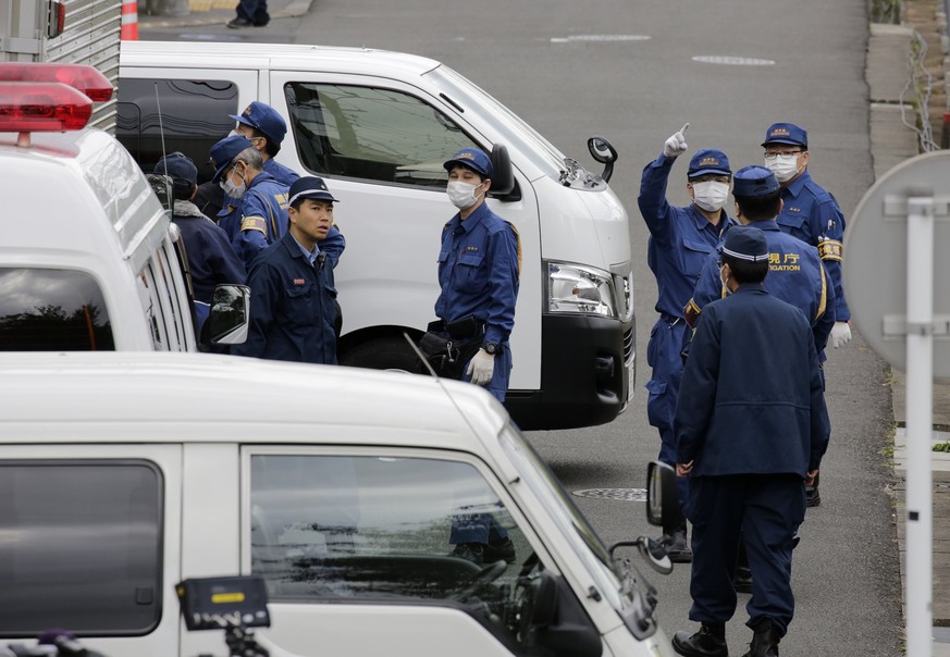 epa06299187 Police investigators and crime lab experts work outside an apartment building in Zama, Kanagawa Prefecture, Japan, 31 October 2017. A 27-year-old man was arrested on 31 October 2017 after  ...