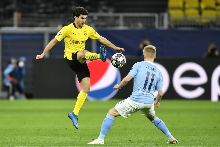 Dortmund&#039;s Mateu Morey, left, challenges for the ball with Manchester City&#039;s Oleksandr Zinchenko during the Champions League quarterfinal second leg soccer match between Borussia Dortmund an ...