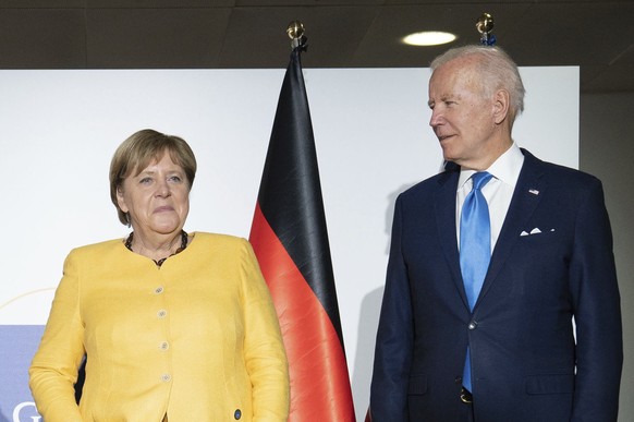 From left, British Prime Minister Boris Johnson, French President Emmanuel Macron, German Chancellor Angela Merkel and U.S. President Joe Biden at the G20 summit in Rome, Saturday, Oct. 30, 2021. The  ...