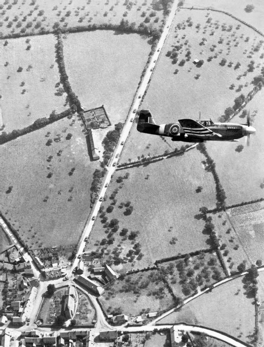 epa04237976 An undated handout photograph released by the British Ministry of Defence (MOD) on 03 June 2014 shows a Royal Air force Mustang aircraft of II (Army Cooperation) Squadron in flight over Fr ...