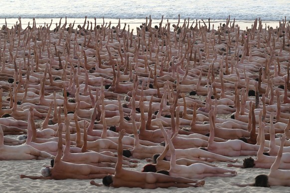 epa10328982 Thousands of people lay nude, as part of an installation by contemporary artist Spencer Tunick, at Bondi Beach in Sydney, Australia 26 November 2022. Thousands of people have bared all for ...