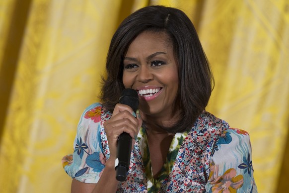 FILE - In this April 22, 2015 file photo, first lady Michelle Obama speaks in the East Room in Washington. Heading out on a weeklong European trip with stops in London and three Italian cities, Michel ...