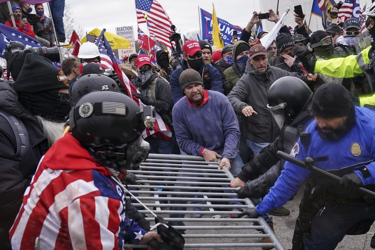 Trump supporters try to break through a police barrier, Wednesday, Jan. 6, 2021, at the Capitol in Washington. As Congress prepares to affirm President-elect Joe Biden's victory, thousands of peo ...