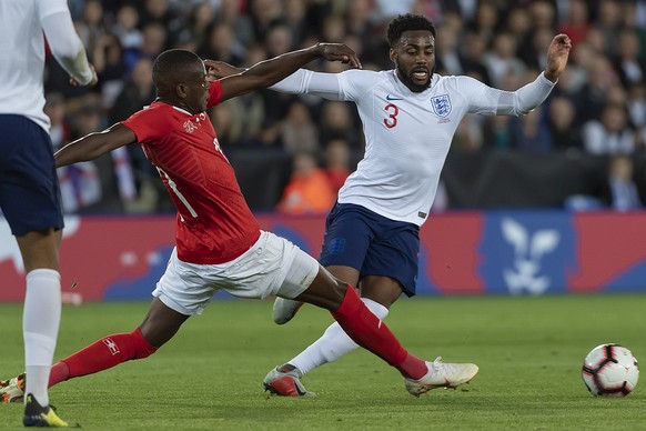 Switzerland&#039;s Denis Zakaria, left, fights for the ball against England&#039;s Danny Rose, right, during the friendly soccer match between England and Switzerland at the King Power Stadium in Leic ...