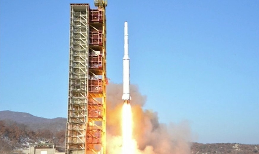 epa05147401 A handout picture made available by the North Korean Central Television (KCTV) Broadcasting Station shows North Korea's 'Kwangmyongsong-4' satellite being fired from the Dongchang-ri launc ...