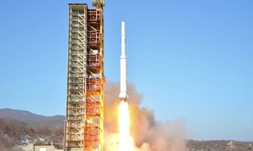 epa05147401 A handout picture made available by the North Korean Central Television (KCTV) Broadcasting Station shows North Korea&#039;s &#039;Kwangmyongsong-4&#039; satellite being fired from the Don ...