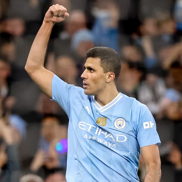 epa11257561 Rodri of Manchester City celebrates after scoring the 1-0 goal during the English Premier League match between Manchester City and Aston Villa in Manchester, Britain, 03 April 2024. EPA/AD ...