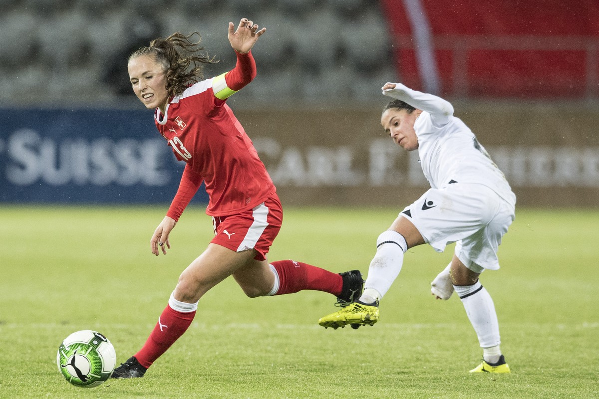 Swiss Lia Waelti, left, fights for the ball against Albania's Furtuna Velaj during the women's World Championship qualifying soccer match between Switzerland and Albania in Biel, Switzerland ...