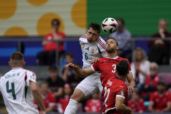Hungary&#039;s Willi Orban, left, and Switzerland&#039;s Silvan Widmer challenge for the ball during a Group A match between Hungary and Switzerland at the Euro 2024 soccer tournament in Cologne, Germ ...