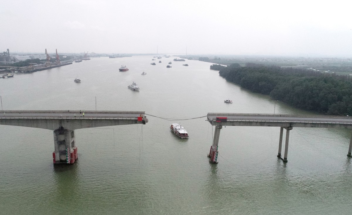 epa11171515 An aerial view taken with a drone shows the fractured Lixinsha Bridge in Nansha District of Guangzhou, south China's Guangdong Province, 22 February 2024. Two people were killed and t ...