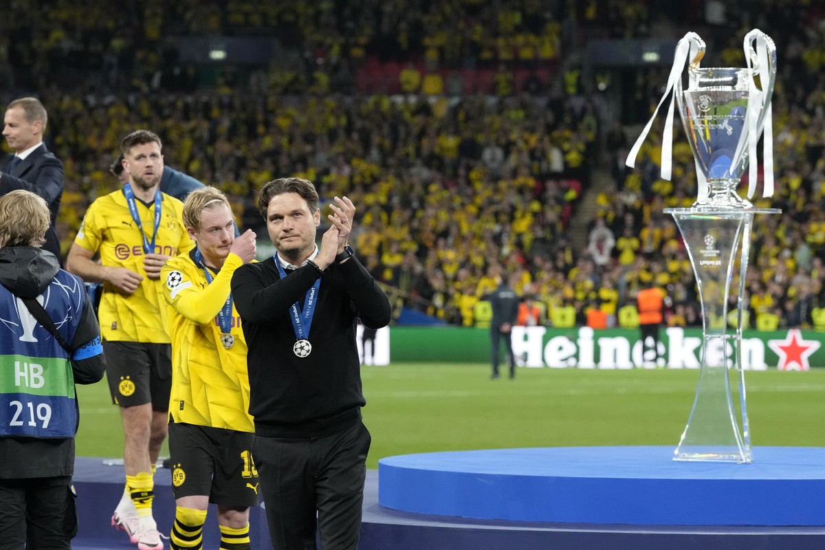 Dortmund's head coach Edin Terzic applauds after collecting his second place medal after the Champions League final soccer match between Borussia Dortmund and Real Madrid at Wembley stadium in Lo ...