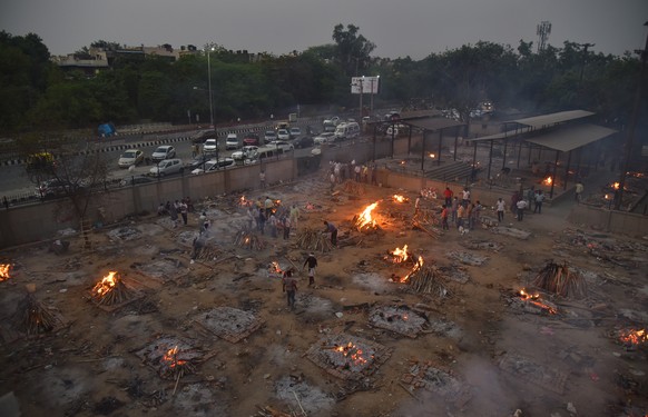 epa09163668 A mass funeral takes place for COVID-19 victims at a cremation ground in New Delhi, India 27 April 2021. WHO Chief Tedros Adhanom Ghebreyesus told reporters that the situation in India is  ...