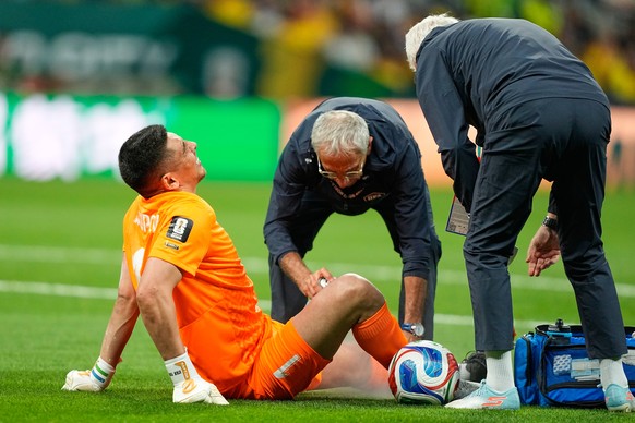 Uzbekistan goalkeeper Utkir Yusupov receives treatment during the World Cup Group K soccer match between Uzbekistan and Colombia in Mexico City, Wednesday, June 17, 2026. (AP Photo/Natacha Pisarenko)
 ...