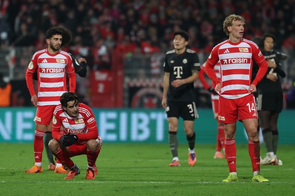 epa12568086 Diogo Leite of Union Berlin (2-L) and Leopold Querfeld of Union Berlin (R) react after the DFB Cup round of sixteen match between 1. FC Union Berlin and Bayern Munich, in Berlin, Germany,  ...