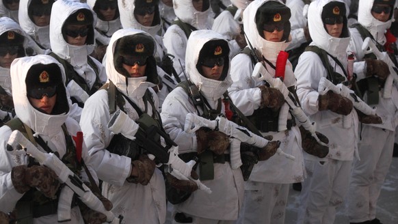 FILE - In this Wednesday, Jan. 20, 2016, file photo, Chinese People&#039;s Liberation Army (PLA) soldiers stand in formation during a winter training drill in Heihe in northeastern China&#039;s Heilon ...