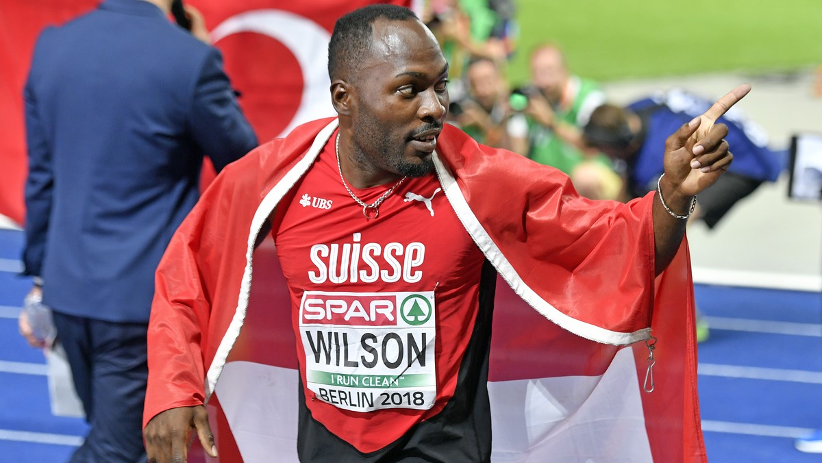 Switzerland's Alex Wilson celebrates after win the bronze medal in the men's 200m final at the 2018 European Athletics Championships in the Olympiastadion stadium in Berlin, Germany, Thursda ...