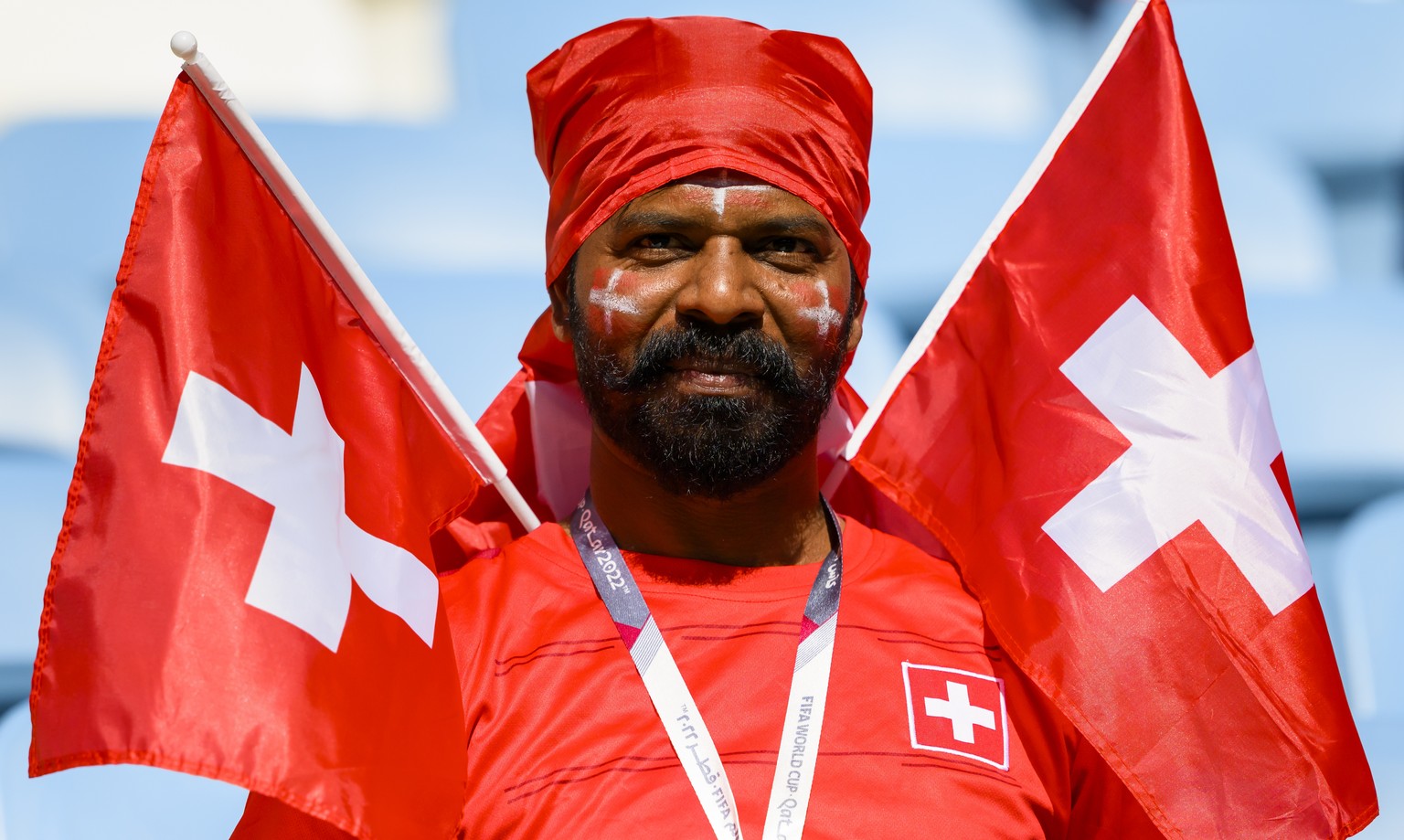 Swiss fan celebrates during the FIFA World Cup Qatar 2022 group G soccer match between Switzerland and Cameroon at the Al-Janoub Stadium in Al-Wakrah, south of Doha, Qatar, Thursday, November 24, 2022 ...