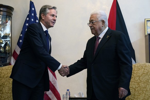 U.S. Secretary of State Antony Blinken, left, shake hands with Palestinian President Mahmoud Abbas, in Amman, Jordan, Friday Oct. 13, 2023. (AP Photo/Jacquelyn Martin, Pool)
Antony Blinken,Mahmoud Abb ...