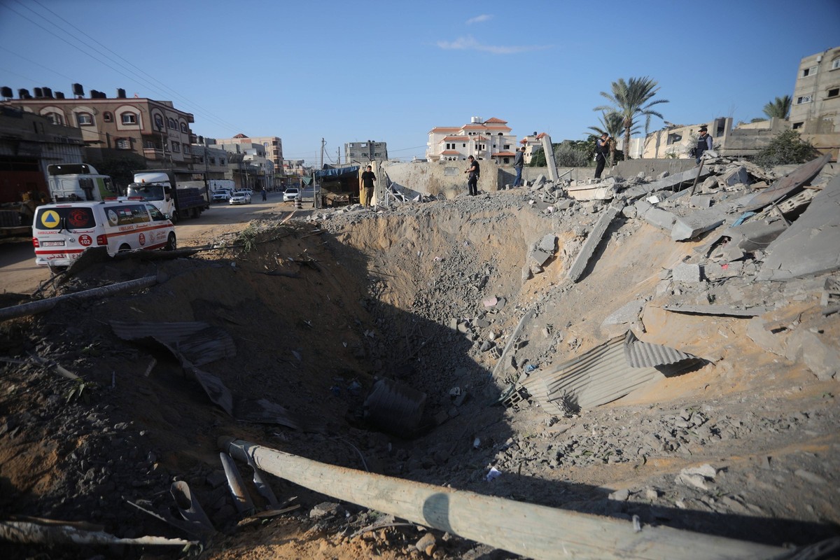 The edge of a large crater following an Israeli airstrike in Rafah, in the southern of Gaza Strip on Monday October 16, 2023. The death toll from Israeli strikes on the Gaza Strip has risen to close t ...