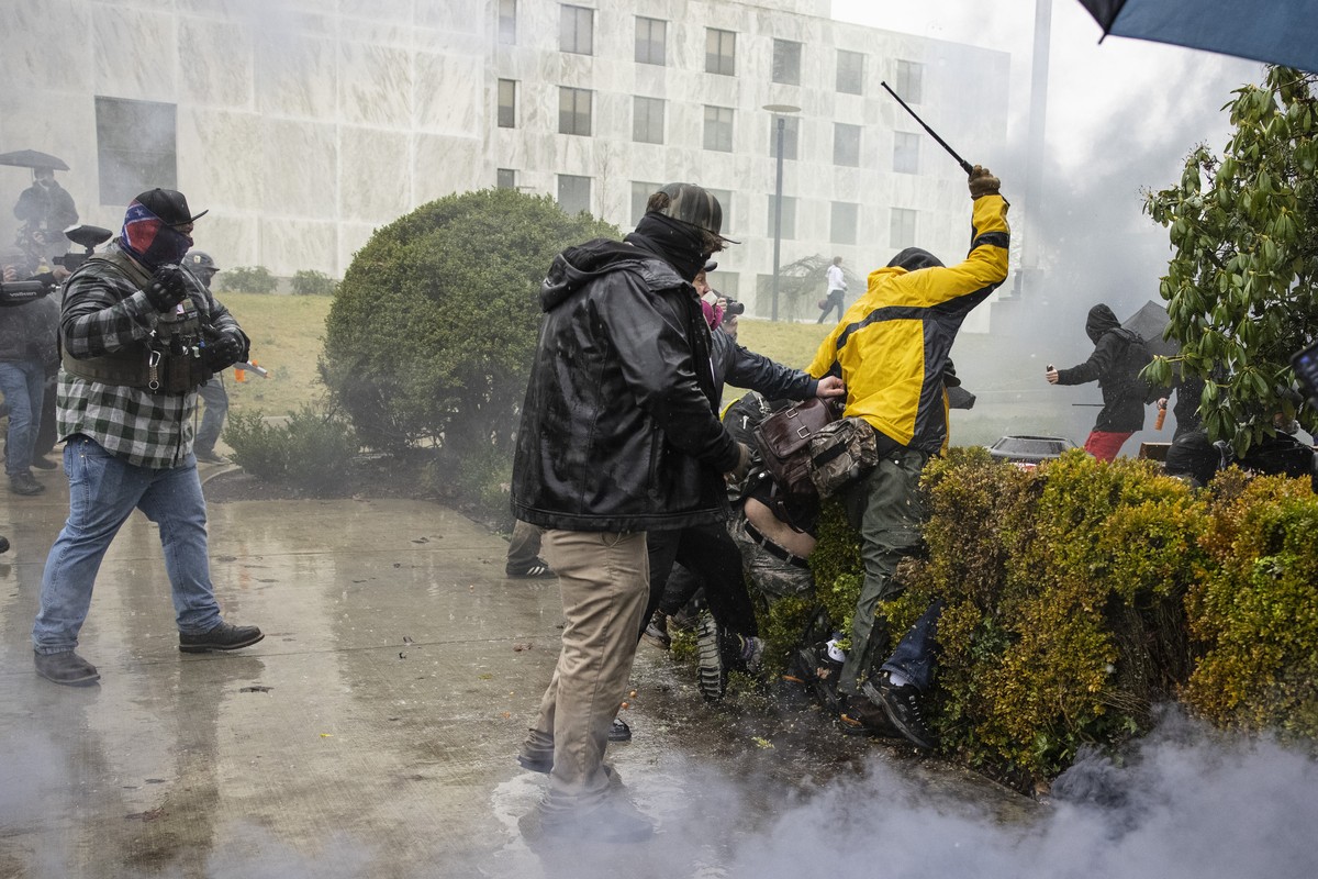 Protesters clash with counter-protesters at the Capitol on Wednesday, Jan. 6, 2021 in Salem, Ore. Thousands of President Donald Trump's supporters caused violence and chaos in Washington while Co ...