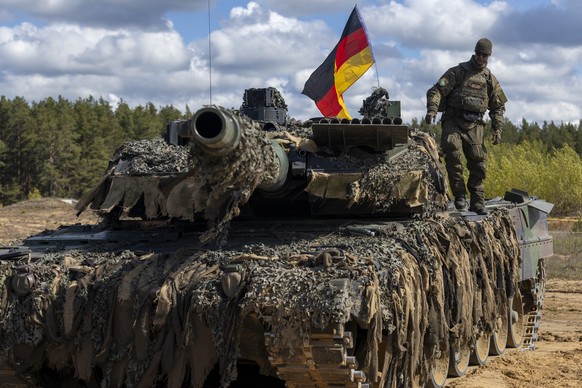 German soldier walks on the Main battle tank Loepard 2A6 during a military exercise &#039;Iron Wolf 2025-I&#039; at the Gaiziunai Training Area, some 130 kms (80 miles) west of the capital Vilnius, Li ...