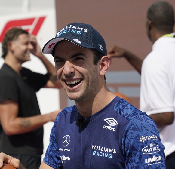 Williams driver Nicholas Latifi, of Canada, prepares to shoot free throws at the Formula One U.S. Grand Prix auto race at the Circuit of the Americas, Thursday, Oct. 21, 2021, in Austin, Texas. F1 Tea ...