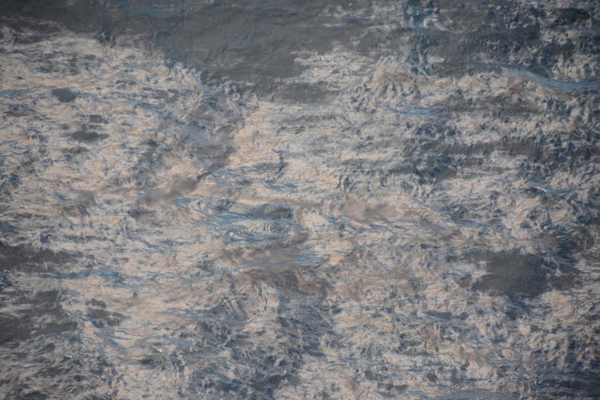 epa07436253 A handout photo made available by the Information Division of the French Maritime Prefecture of Atlantic on 14 March 2019 shows an oil slick of 10 kilometer long and one kilometer wide com ...