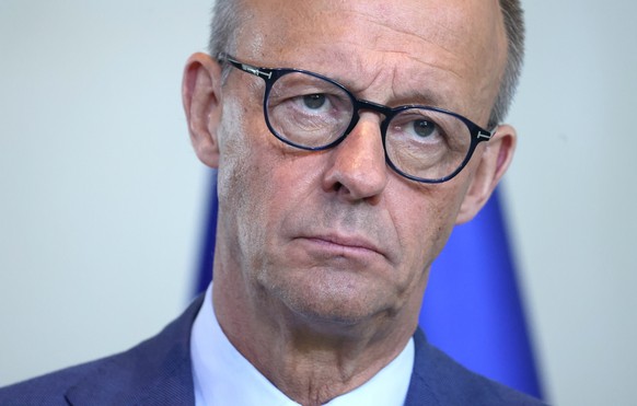 epa12973246 German Chancellor Friedrich Merz attends a news conference after talks with the Swiss President (not pictured) at the Chancellery in Berlin, Germany, 19 May 2026. EPA/HANNIBAL HANSCHKE