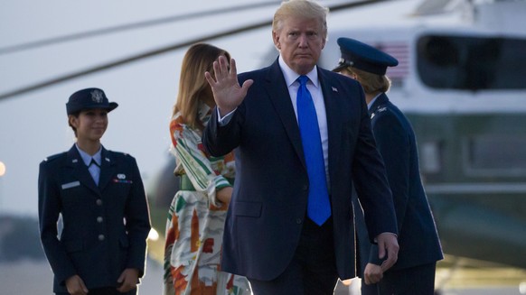 President Donald Trump, with first lady Melania Trump, waves as they walk to Air Force One as they depart Sunday, June 2, 2019, at Andrews Air Force Base, Md. Trump is going to London, France and Irel ...