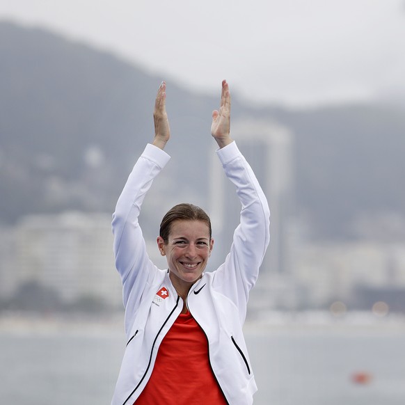 Nicola Spirig Hug, of Switzerland, waves before receiving the silver medal in the women&#039;s triathlon event on Copacabana beach at the 2016 Summer Olympics in Rio de Janeiro, Brazil, Saturday, Aug. ...