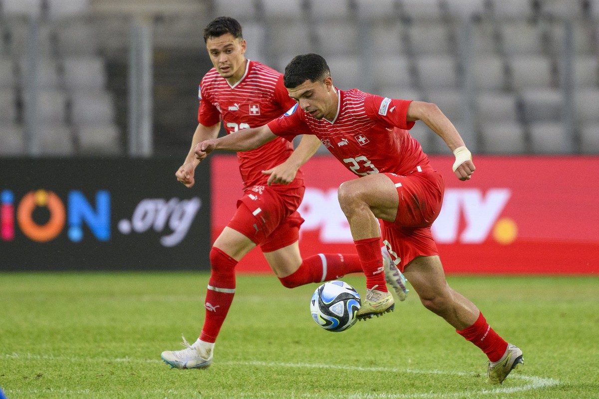 Switzerland's Zeki Amdouni, front, and Fabian Rieder, back, during a Group D match between Switzerland and Italy at the 2023 UEFA European Under-21 Championship final tournament in the Cluj Arena ...