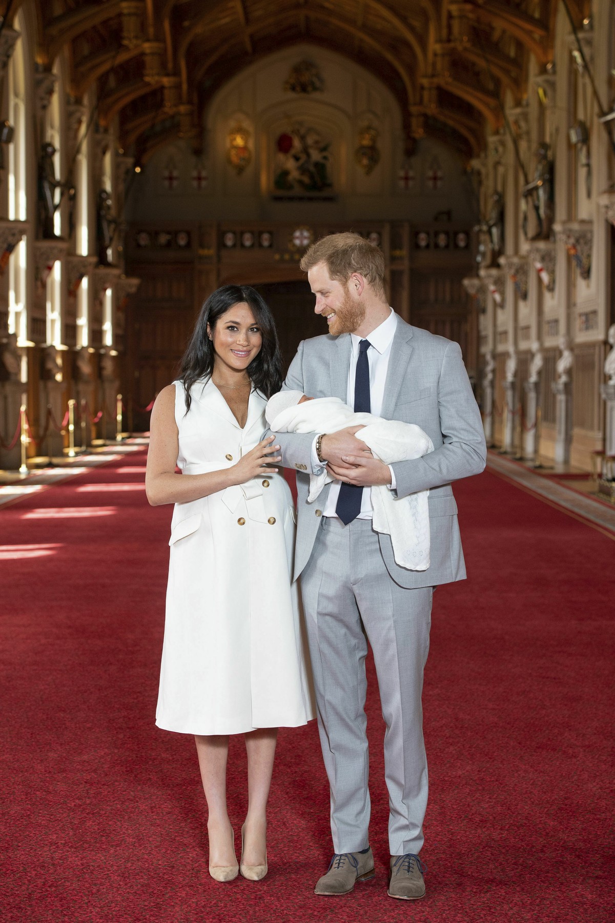 Britain's Prince Harry and Meghan, Duchess of Sussex, during a photocall with their newborn son, in St George's Hall at Windsor Castle, Windsor, south England, Wednesday May 8, 2019. Baby Su ...