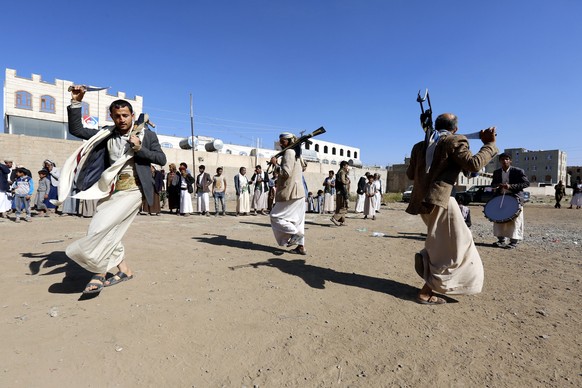 epa07229249 Supporters of the Houthi rebel movement perform traditional dances during a gathering to show support to the Houthi rebels, in Sana&#039;a, Yemen, 13 December 2018. According to reports, Y ...
